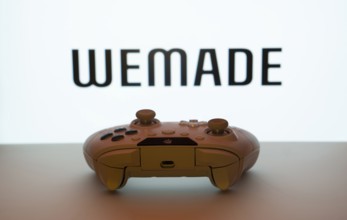 Dhaka, Bangladesh- 14 Nov 2025: A close-up of a white gamepad with the WeMade Entertainment seen on