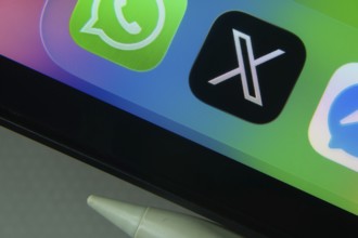 16 Nov 2025- Dhaka, Bangladesh: X and other app icons with a digital pen on a iPad screen