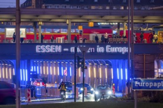 The main train station in Essen, blue-lit underpass, bus station, am Europaplatz, public transport