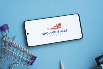 Dhaka, Bangladesh- 21 Nov 2025: Smartphone displaying Shop Apotheke logo with shopping cart on a