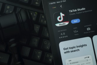 Dhaka, Bangladesh- 28 Oct 2025: An iPad displaying the tiktok Studio app against a judge's gavel