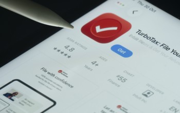 Dhaka, Bangladesh- 30 Oct 2025: TurboTax app on a iPad screen with a pen pointing at the install