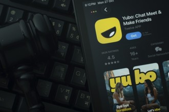 Dhaka, Bangladesh- 28 Oct 2025: An iPad displaying the Yubo app against a judge's gavel and dark