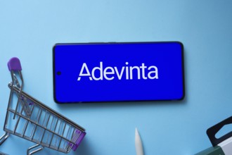 Dhaka, Bangladesh- 03 July 2025: Smartphone displaying Adevinta logo with shopping cart on a blue