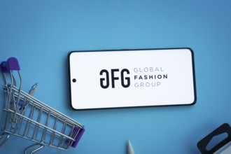Dhaka, Bangladesh- 21 Nov 2025: Smartphone displaying Global Fashion Group logo with shopping cart