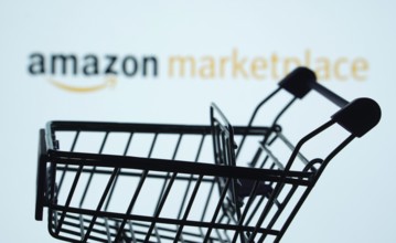Dhaka, Bangladesh- 21 Nov 2025: Silhouette of a shopping cart in front of the amazon marketplace