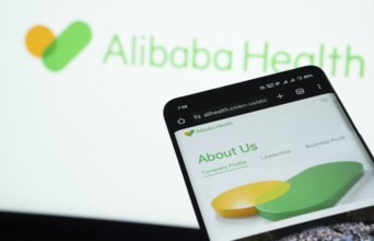 Dhaka, Bangladesh- 21 Nov 2025: Smartphone displaying Alibaba Health web interface against Alibaba