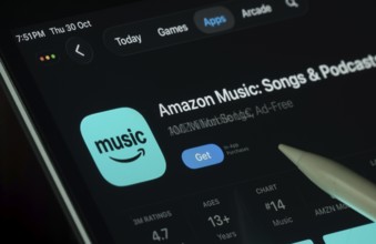 Dhaka, Bangladesh- 21 Nov 2025: Amazon Music app displayed on a iPad screen in dark mode with a