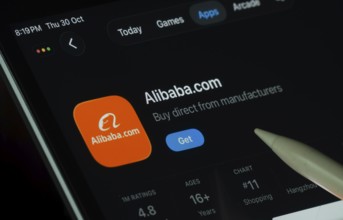 Dhaka, Bangladesh- 21 Nov 2025: Alibaba.com app displayed on a iPad screen in dark mode with a
