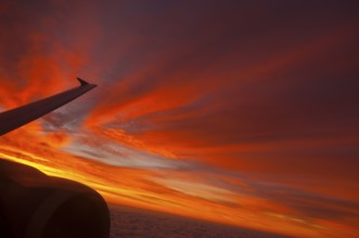 View from airplane window at sunrise