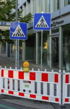 Barriers and signs with traffic signs at road construction sites in Berlin Mitte, Berlin, Germany
