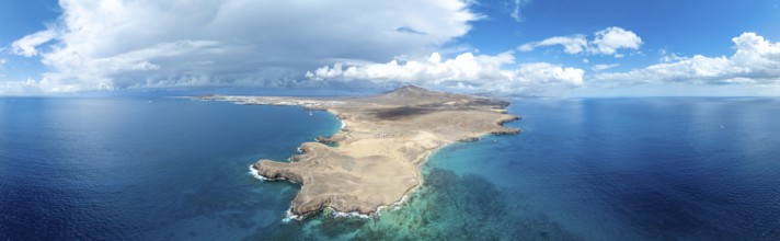 Headland and blue sea, coastal landscape, arid landscape of Los Ajaches Natural Park, aerial view,