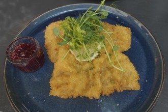 Wiener schnitzel, breaded veal schnitzel, meat dish served on plate, main course, breadcrumbs,