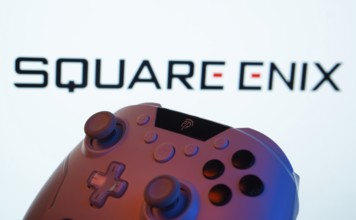 Dhaka, Bangladesh- 14 Nov 2025: A close-up of a gamepad with the Square Enix seen on screen in the