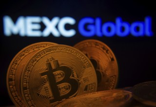 Dhaka, Bangladesh- 03 Sep 2025: Close-up of Bitcoin coins with the MEXC Global logo visible on a