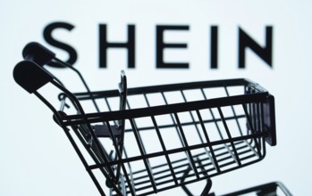 Dhaka, Bangladesh- 03 July 2025: Silhouette of a shopping cart in front of the SHEIN logo,