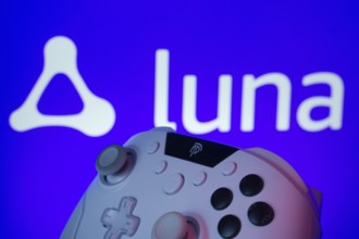 Dhaka, Bangladesh- 14 Nov 2025: A close-up of a gamepad with the Amazon Luna seen on screen in the