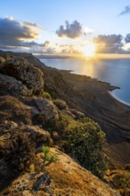 View of steep cliffs on sea and coast, Mirador del Porrito viewpoint at sunset, Lanzarote, Canary