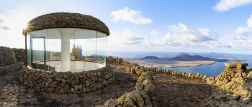 Stairway and viewing platform at the Mirador del Río viewpoint, in the evening light with sun