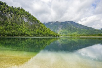 Landscape of Lake Offensee after rain when the sun comes through the clouds in spring,