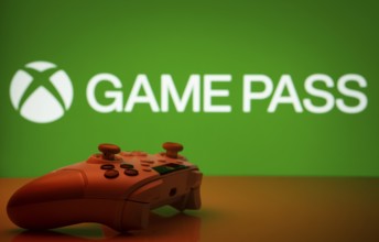 Dhaka, Bangladesh- 19 Sep 2025: A close-up of a white gamepad with the Xbox Game Pass seen on