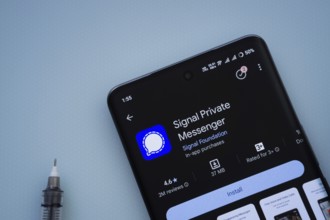 Dhaka, Bangladesh- 29 May 2025: On a blue surface, a smartphone displays the Signal app within the