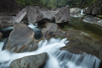 Turquoise blue water between rocks in the tropical rainforest of Babinda Boulders Queensland