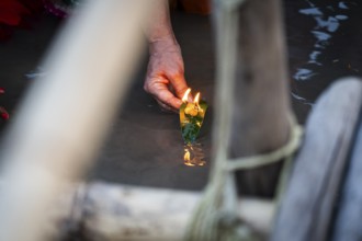 Hindu devotees gather on the banks of the Brahmaputra River to offer prayers to the Sun God on the