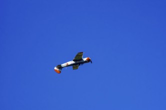 A Jakovlev Jak-52 with registration LY-HLZ during a flight demonstration as part of an air show on