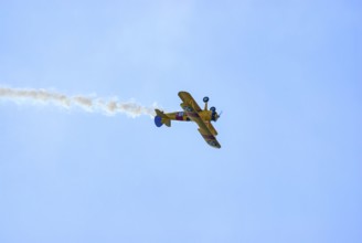 A Boeing-Stearman biplane during a flight demonstration as part of an air show at the Rossfeld in