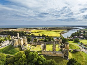 Warkworth Castle over River Coquet from a drone, Warkworth, Northumberland, England, United Kingdom