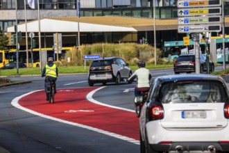 Cycle path, cycle lane, marked in red to draw the attention of motorists to the cycle path, between