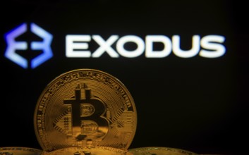 Dhaka, Bangladesh- 06 Sep 2025: Close-up of Bitcoin coins with the Exodus logo visible on a screen