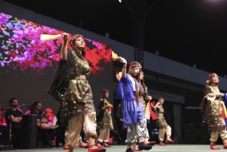 A Kurdish traditional dance troupe performs during the Damascus International Fair, the first