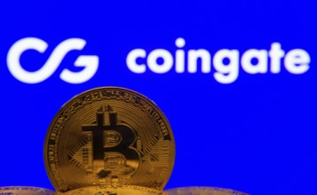 Dhaka, Bangladesh- 03 Sep 2025: Close-up of Bitcoin coins with the Coingate logo visible on a