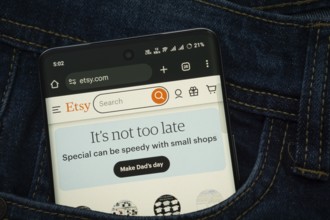 Dhaka, Bangladesh- 15 June 2025: A smartphone displaying the Etsy web interface peeks out of a