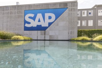 Logo and building of the software company SAP SE. Walldorf, Baden-Württemberg, Germany