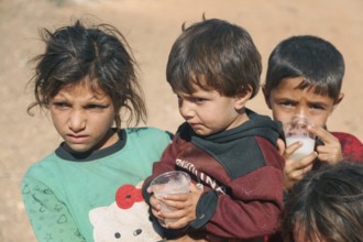 Syrian children playing in a refugee camp near the Turkish border on World Children's Day. Aleppo,
