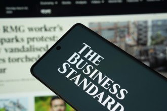 Dhaka, Bangladesh - 18 March 2025: The logo of The Business standard is displayed on a smartphone