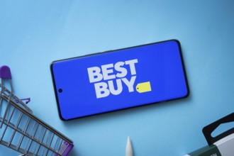 Dhaka, Bangladesh- 03 July 2025: Smartphone displaying Best Buy logo with shopping cart on a blue