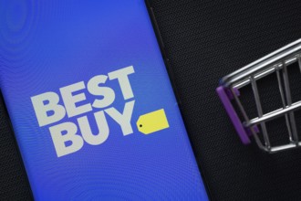 Dhaka, Bangladesh- 03 July 2025: A smartphone displaying the Best Buy logo next to a miniature