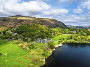 Farms and Mountains over road A591 from a drone, Grasmere Lake, Grasmere, Ambleside, Lake District,
