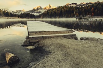 Lake Staz near Sankt Moritz in the Engadin in Switzerland. Morning atmosphere with fog in autumn.