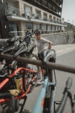 Young woman riding a racing bike on Lake Garda. Sunny weather and dolce vita
