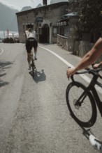 Young woman riding a racing bike on Lake Garda. Sunny weather and dolce vita