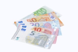 Various euro banknotes on white background, 5 euro, 10 euro, 20 euro, 50 euro, 100 euro