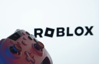 Dhaka, Bangladesh- 26 July 2025: A close-up of a gamepad with the Roblox seen on screen in the