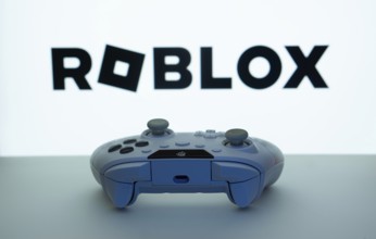 Dhaka, Bangladesh- 26 July 2025: Game controller in front of Roblox logo on a background