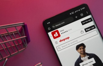 Dhaka, Bangladesh- 23 June 2025: A smartphone displaying the Depop website with a shopping cart is