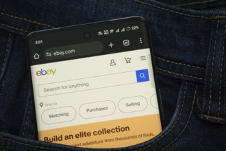 Dhaka, Bangladesh- 15 June 2025: A smartphone displaying the eBay.com web interface peeks out of a